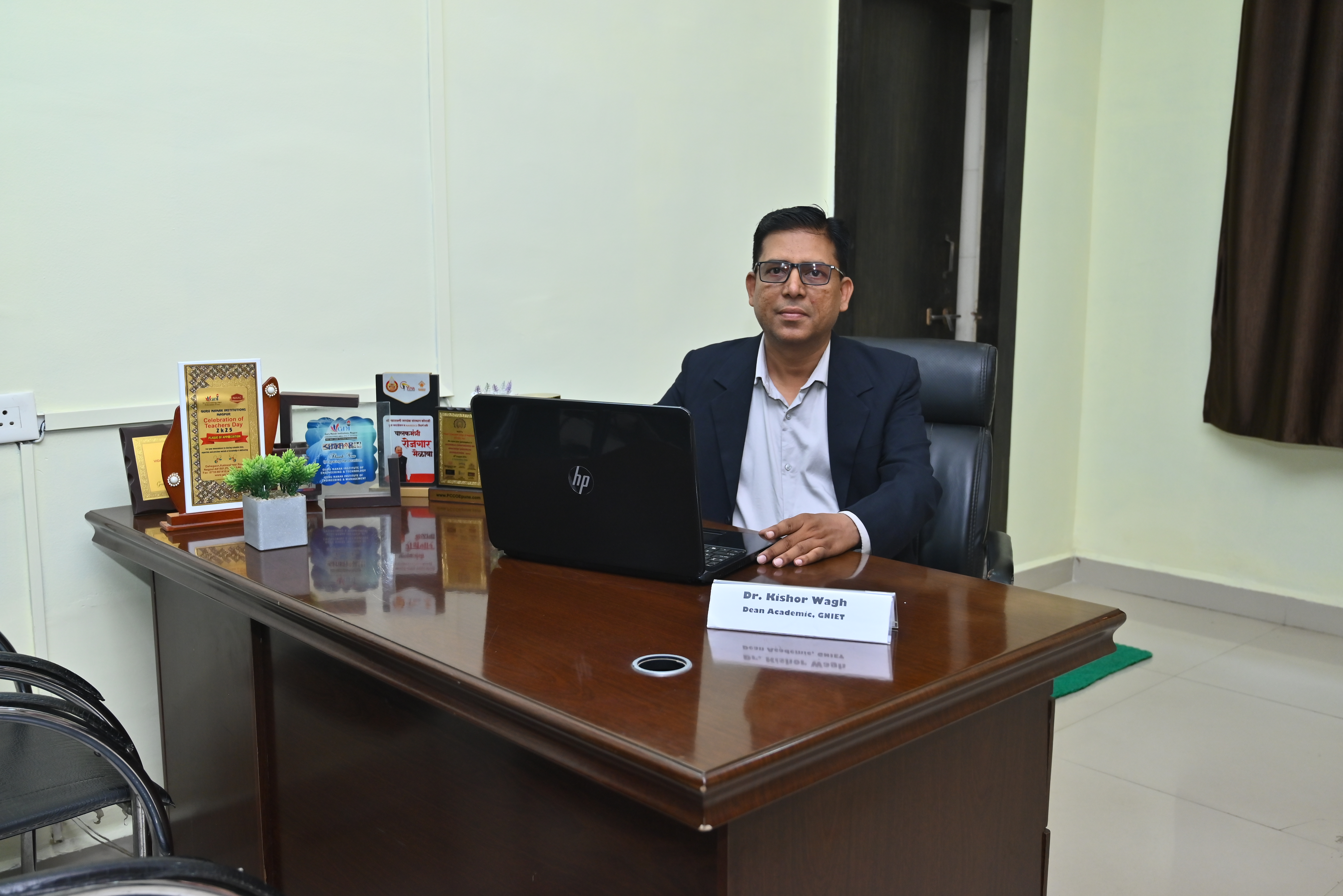 Dr. Kishor Wagh